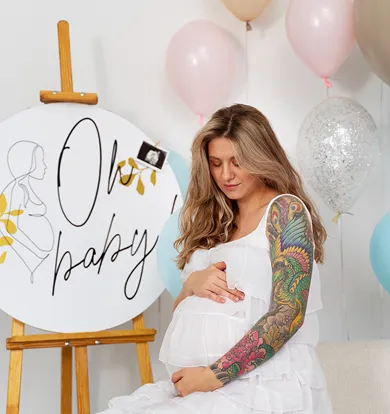 Fun baby shower photo booth props and custom pastel backdrop.