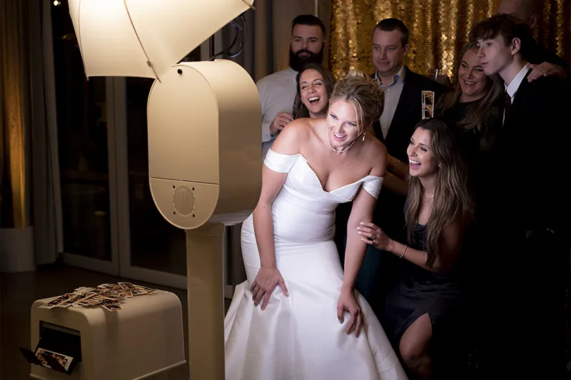 Professional DSLR photo booth with high-quality instant prints and studio lighting.
