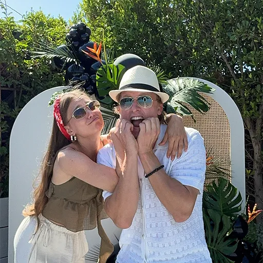 Happy guests posing at a wedding with Olive Branch Photo Booths in California.