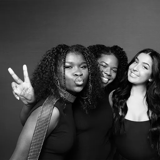 Happy guests posing at a wedding with Olive Branch Photo Booths in California.