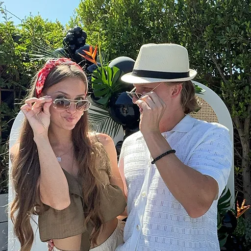 Happy guests posing at a wedding with Olive Branch Photo Booths in California.