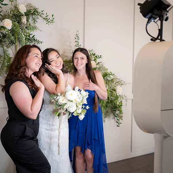 High-quality DSLR photo booth producing studio portraits for wedding guests.