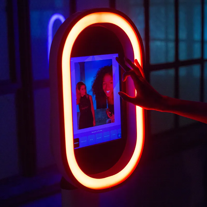 Guests using the easy touchscreen interface on a digital photo booth.